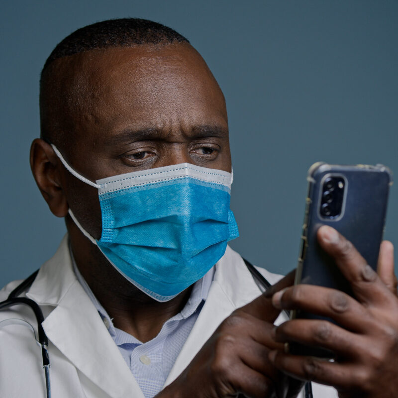 Executive Social Media In The Healthcare Industry article banner featuring doctor using phone