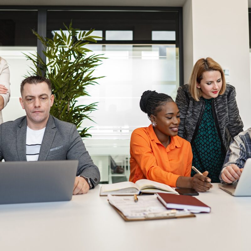 The Experts Behind a Strategic Executive Social Media Program article featured image with a group of office workers