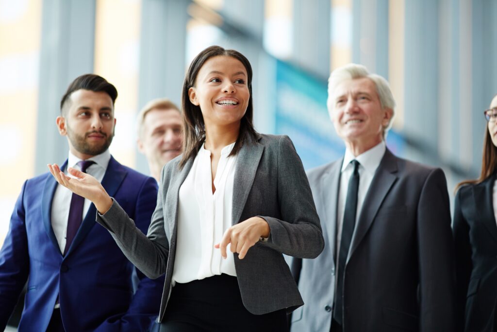 photo featuring a group of business executives talking