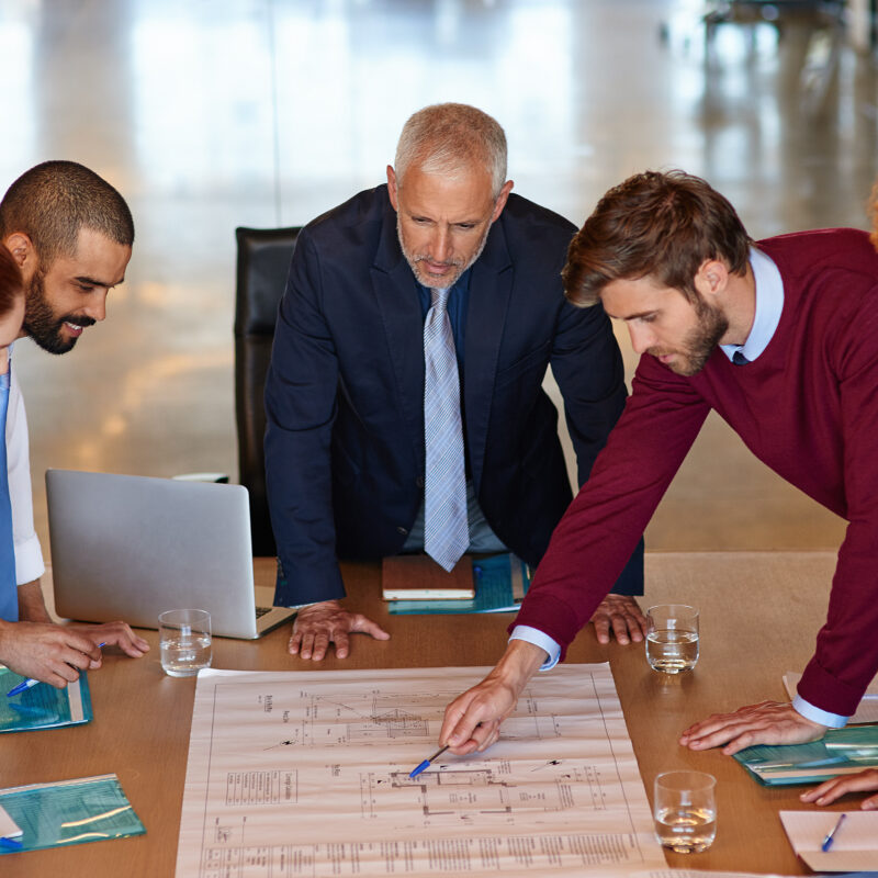 The Executive Social Media Toolkit for 2025 article image banner featuring group of people looking at strategic schematic